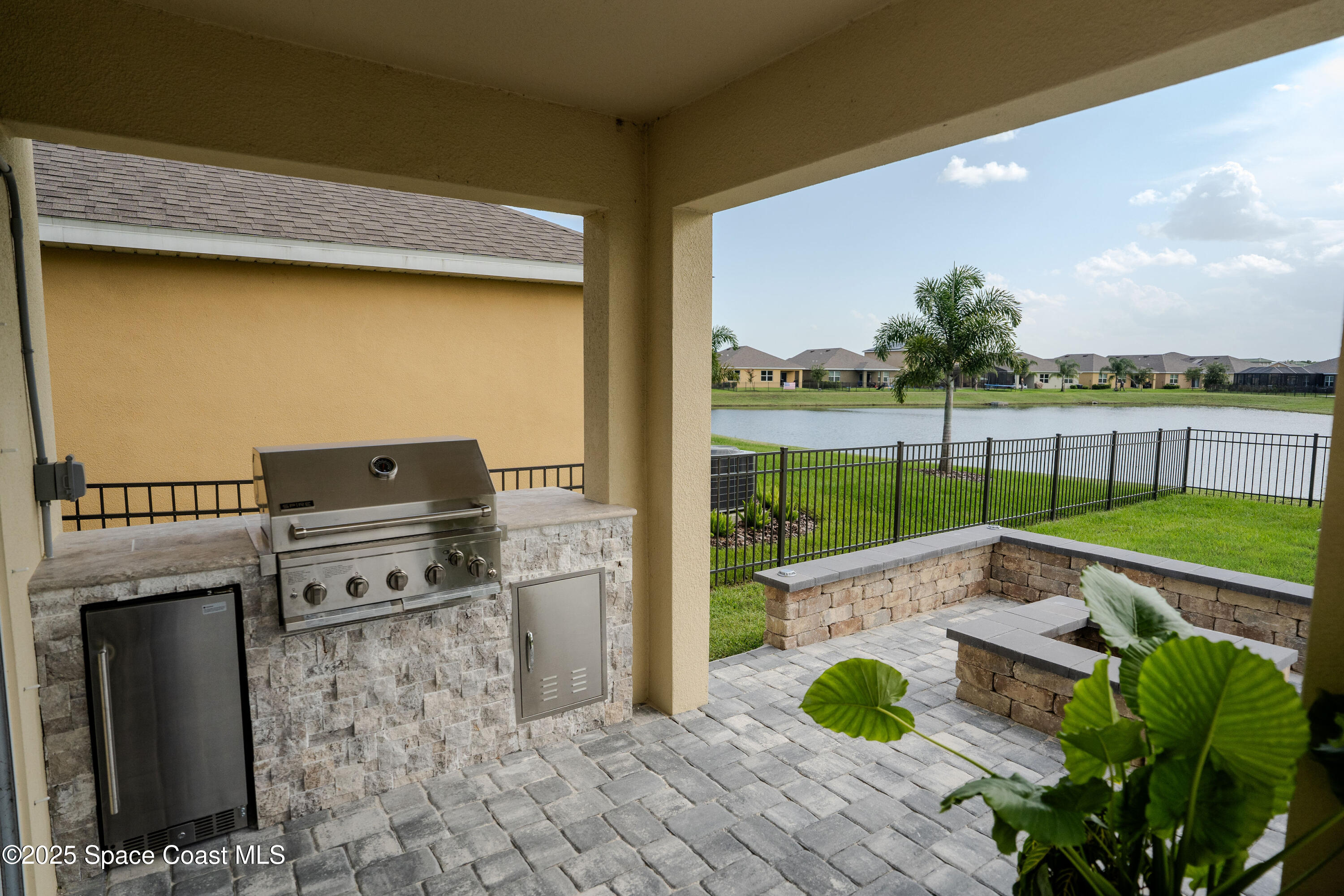 3409 Burrowing Owl Mims, FL 32754 - Photo 6 of 36 a view of a terrace with wooden floor and a garden