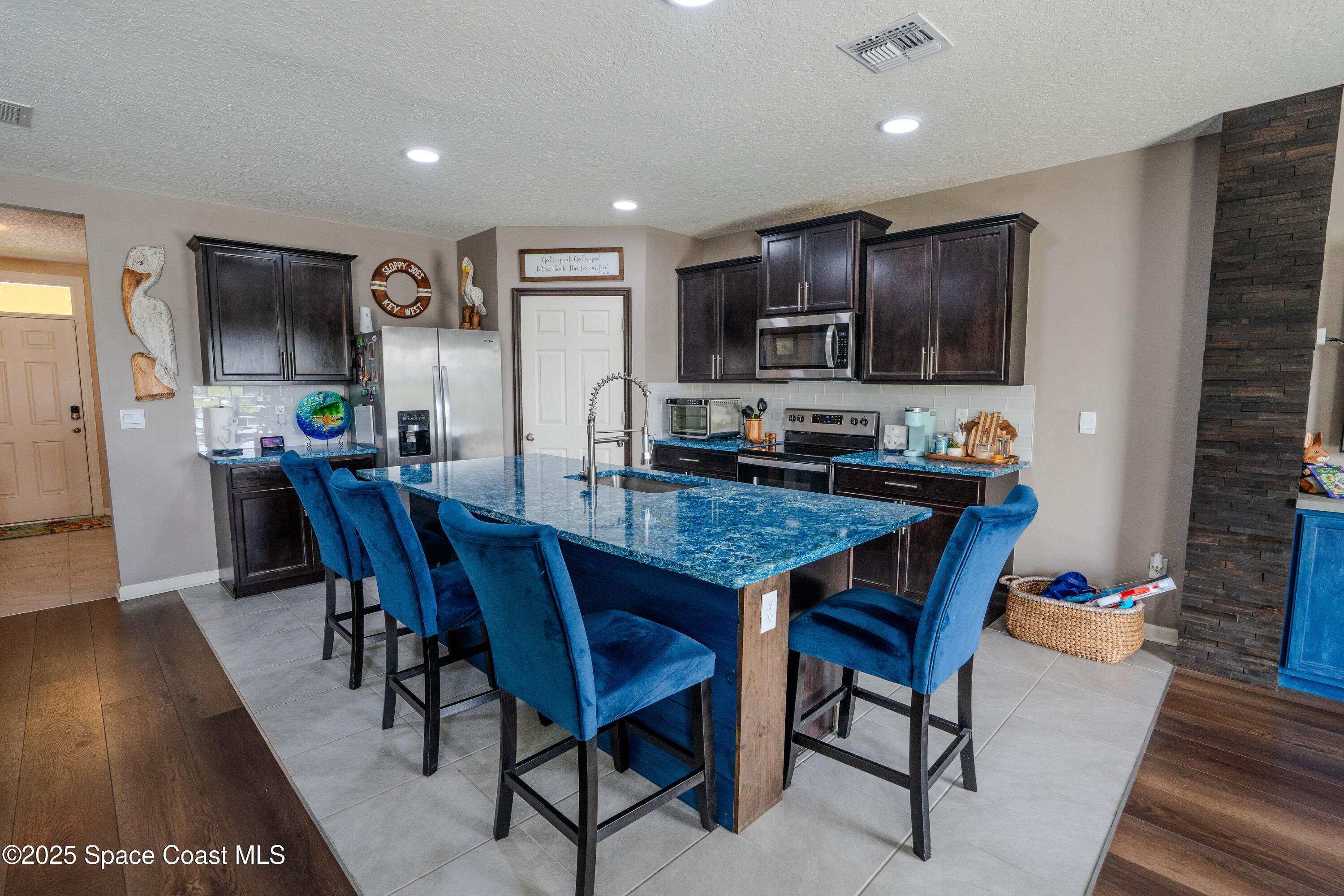 3409 Burrowing Owl Mims, FL 32754 - Photo 9 of 36 a view of a dining room with furniture