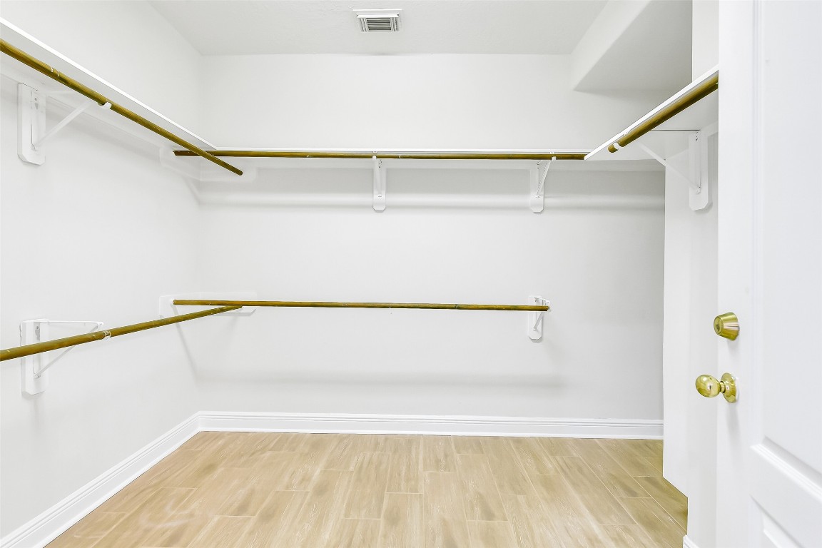 12426 Shadowpoint Drive Houston, TX 77082 - Photo 21 of 42 a view of walk in closet with window and plants