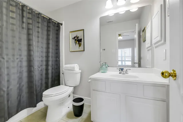 a bathroom with a sink toilet and mirror