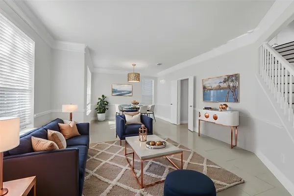 a living room with furniture and a window