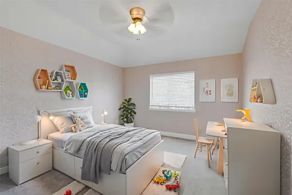 a bedroom with a bed and a window