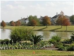 12426 Shadowpoint Drive Houston, TX 77082 - Photo 40 of 42 a view of a lake in middle of the town