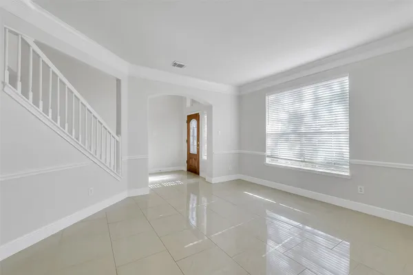 a view of an empty room with a window