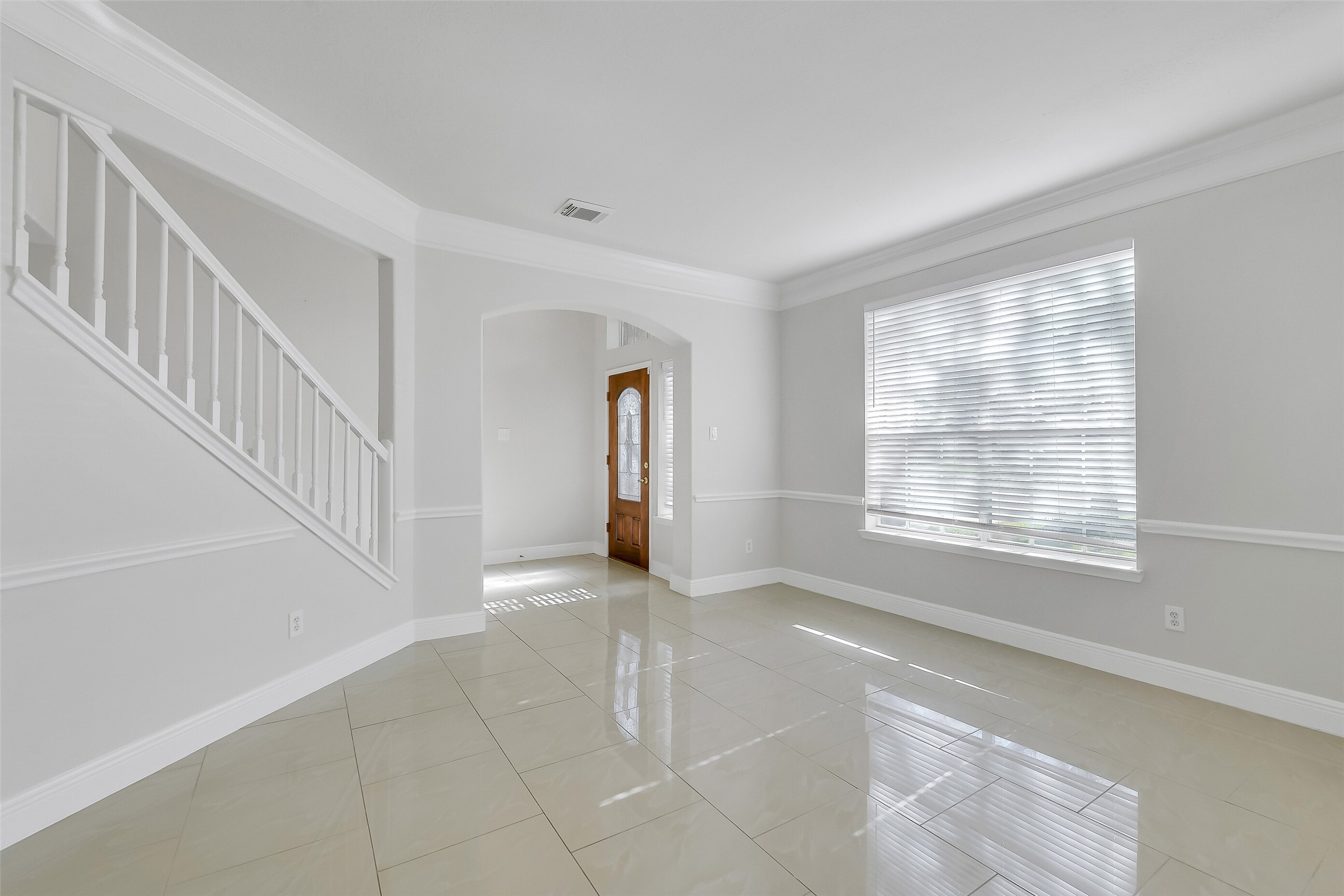 12426 Shadowpoint Drive Houston, TX 77082 - Photo 4 of 42 a view of an empty room with a window