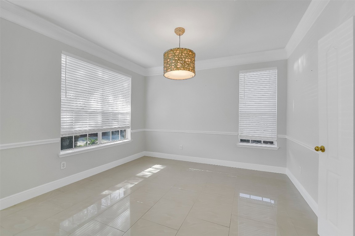 12426 Shadowpoint Drive Houston, TX 77082 - Photo 6 of 42 a view of an empty room with a window