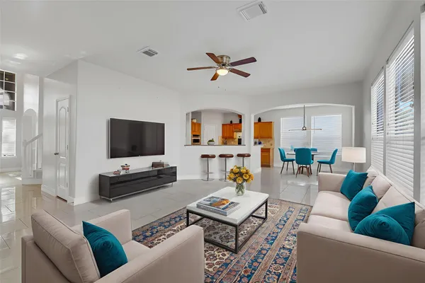 a living room with furniture and a flat screen tv