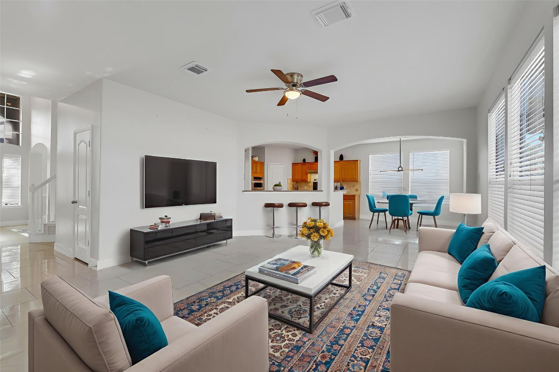 12426 Shadowpoint Drive Houston, TX 77082 - Photo 7 of 42 a living room with furniture and a flat screen tv
