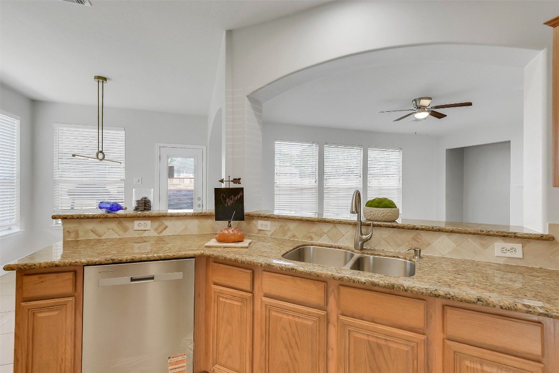 12426 Shadowpoint Drive Houston, TX 77082 - Photo 10 of 42 a kitchen with sink cabinets and window