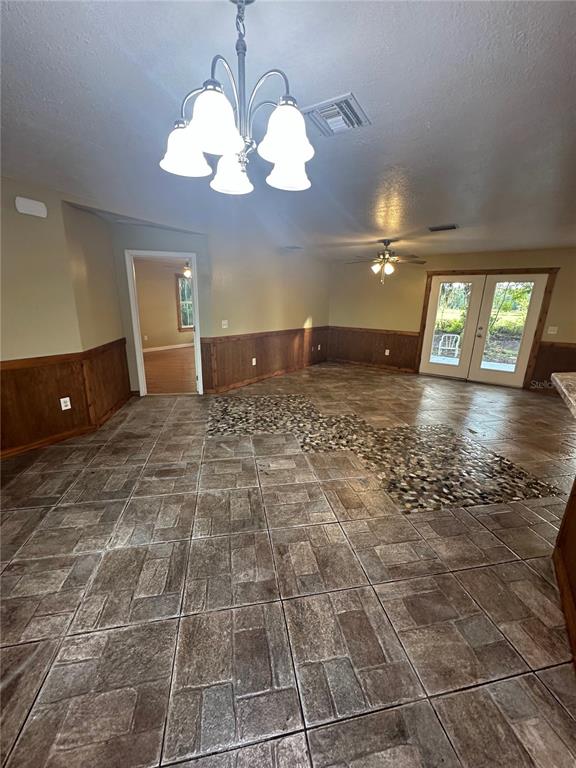 12022 Southeast Sunset Harbor Road Weirsdale, FL 32195 - Photo 5 of 17 a view of a room with lots of furniture and chandelier