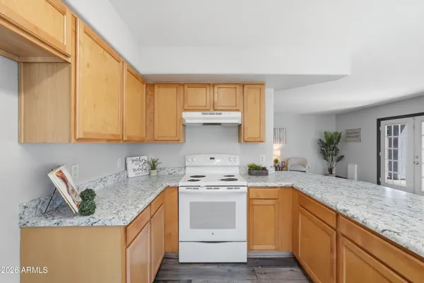 a view of living room with granite countertop furniture and fireplace