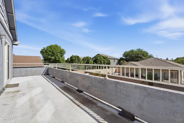a view of a house with backyard porch and sitting area