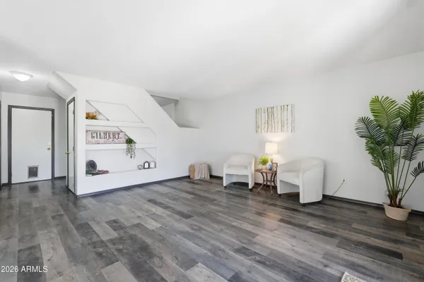 a view of a kitchen with microwave and cabinets