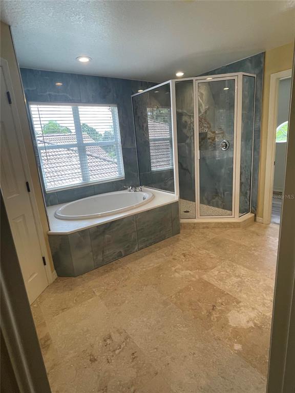 759 Fordingbridge Way Osprey, FL 34229 - Photo 9 of 51 a spacious bathroom with a tub and shower