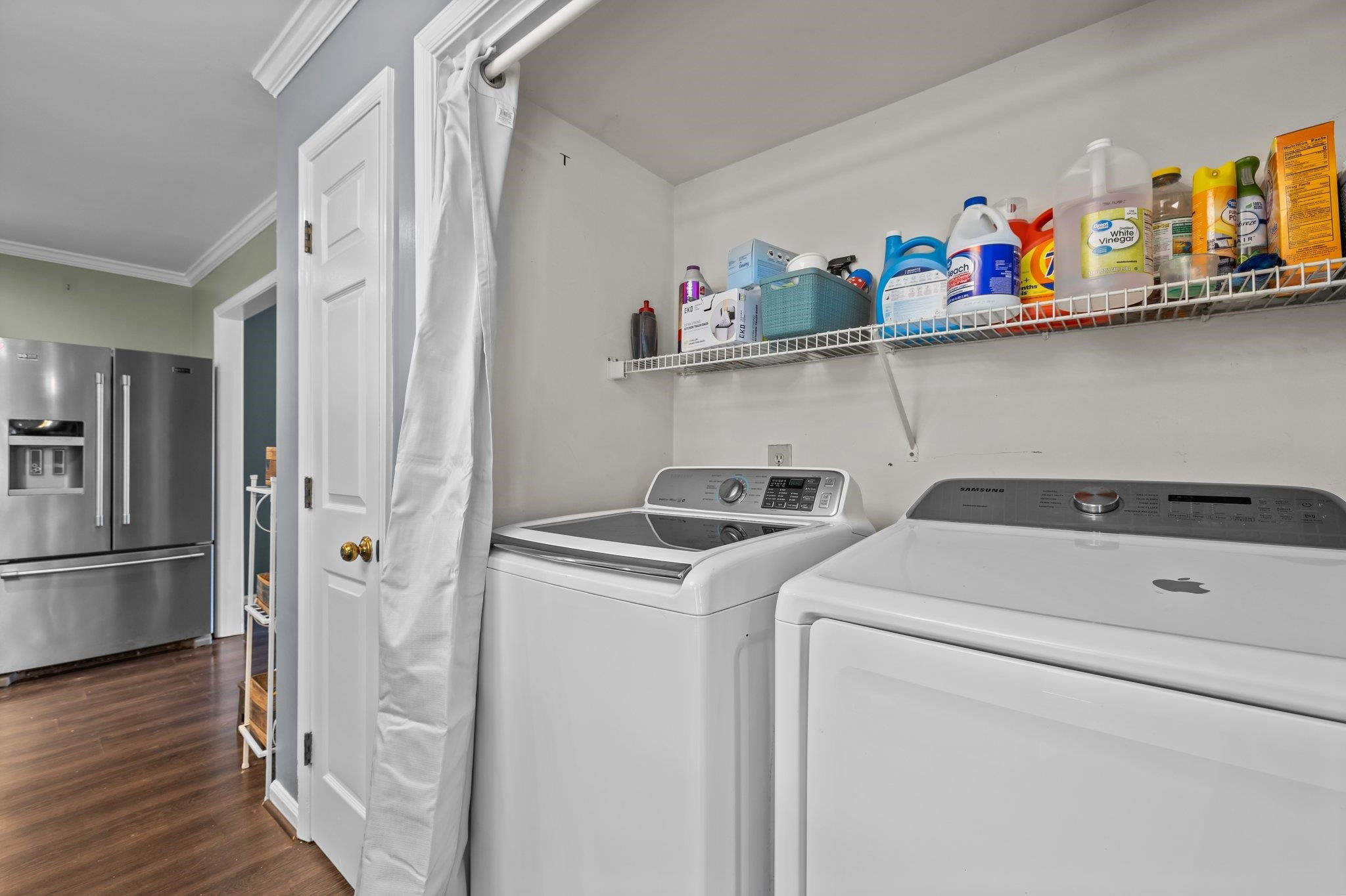 2208 Dobbin Place Raleigh, NC 27604 - Photo 13 of 42 a view of washer and dryer with wooden floor
