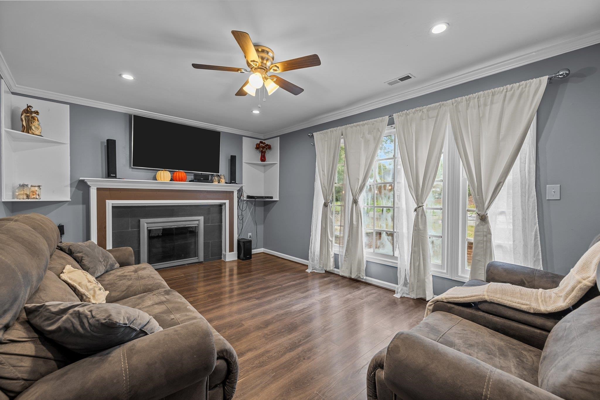 2208 Dobbin Place Raleigh, NC 27604 - Photo 17 of 42 a living room with furniture fireplace and flat screen tv