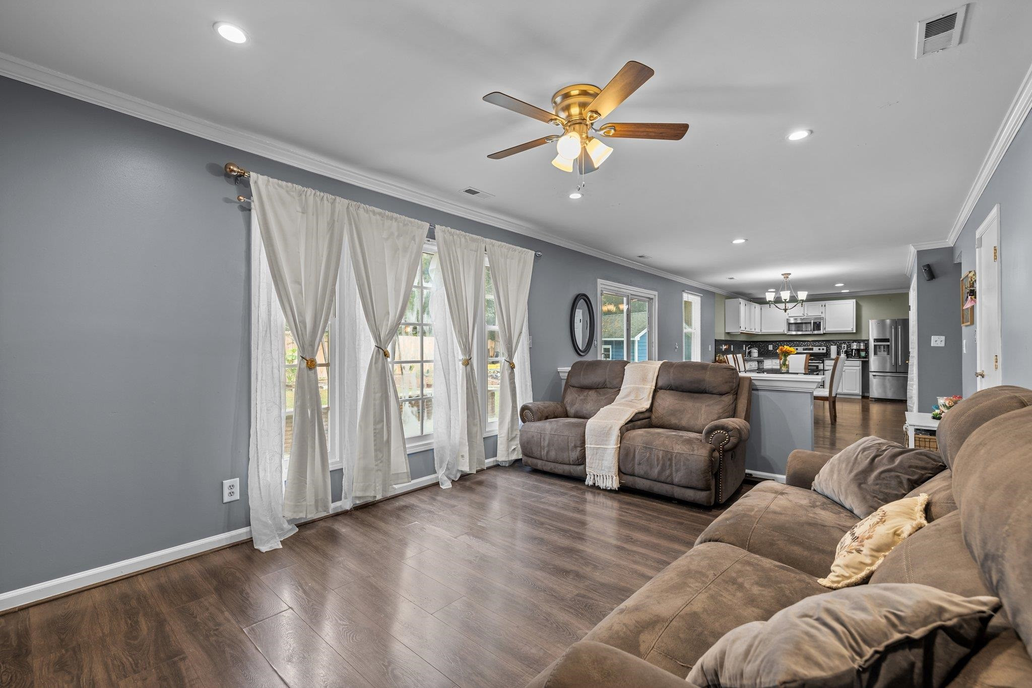2208 Dobbin Place Raleigh, NC 27604 - Photo 19 of 42 a living room with furniture and kitchen view