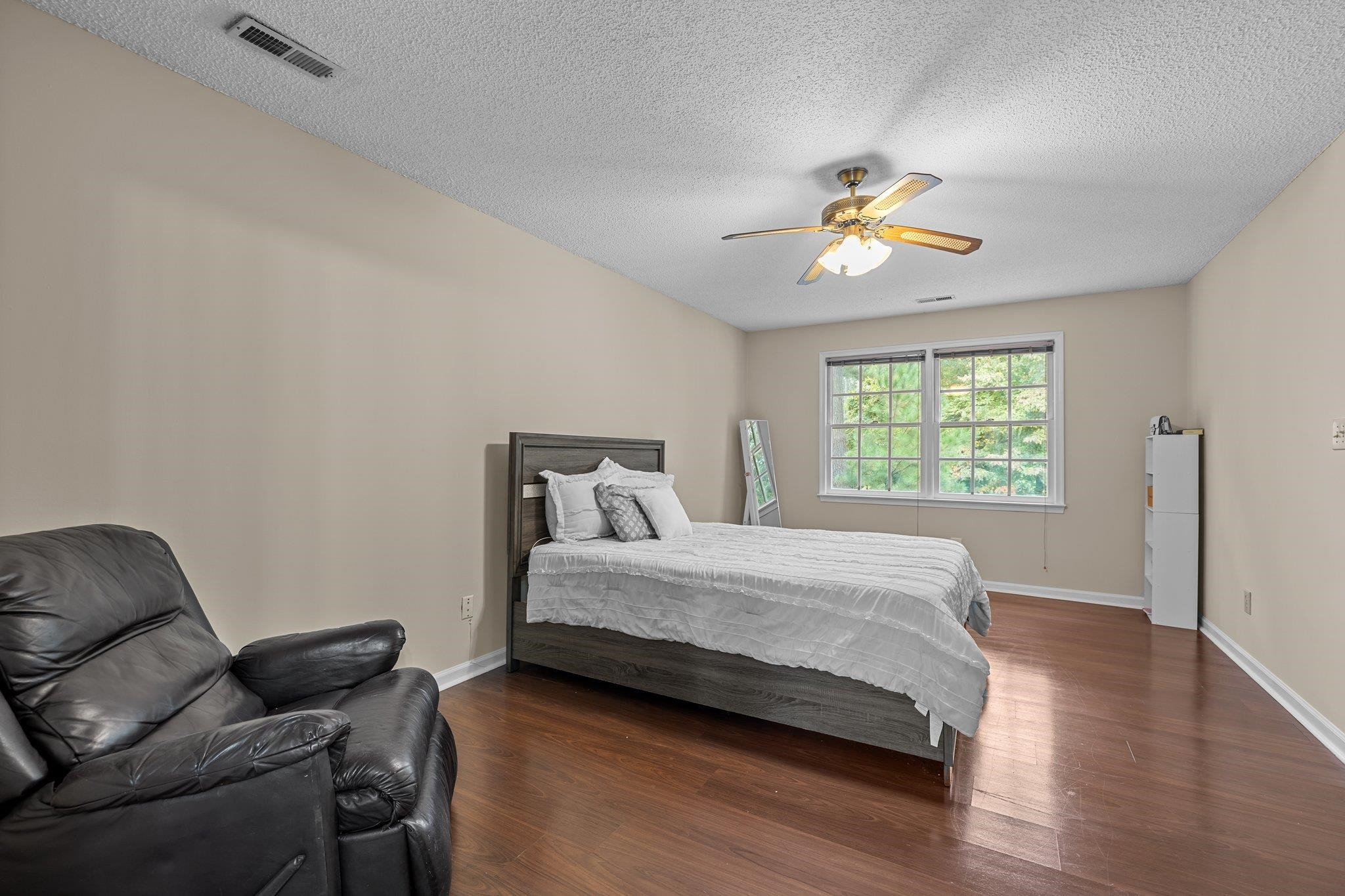 2208 Dobbin Place Raleigh, NC 27604 - Photo 22 of 42 a bedroom with a bed and furniture
