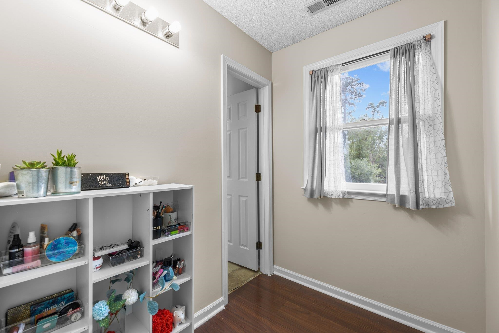 2208 Dobbin Place Raleigh, NC 27604 - Photo 24 of 42 a view of room with hardwood floor and cabinet