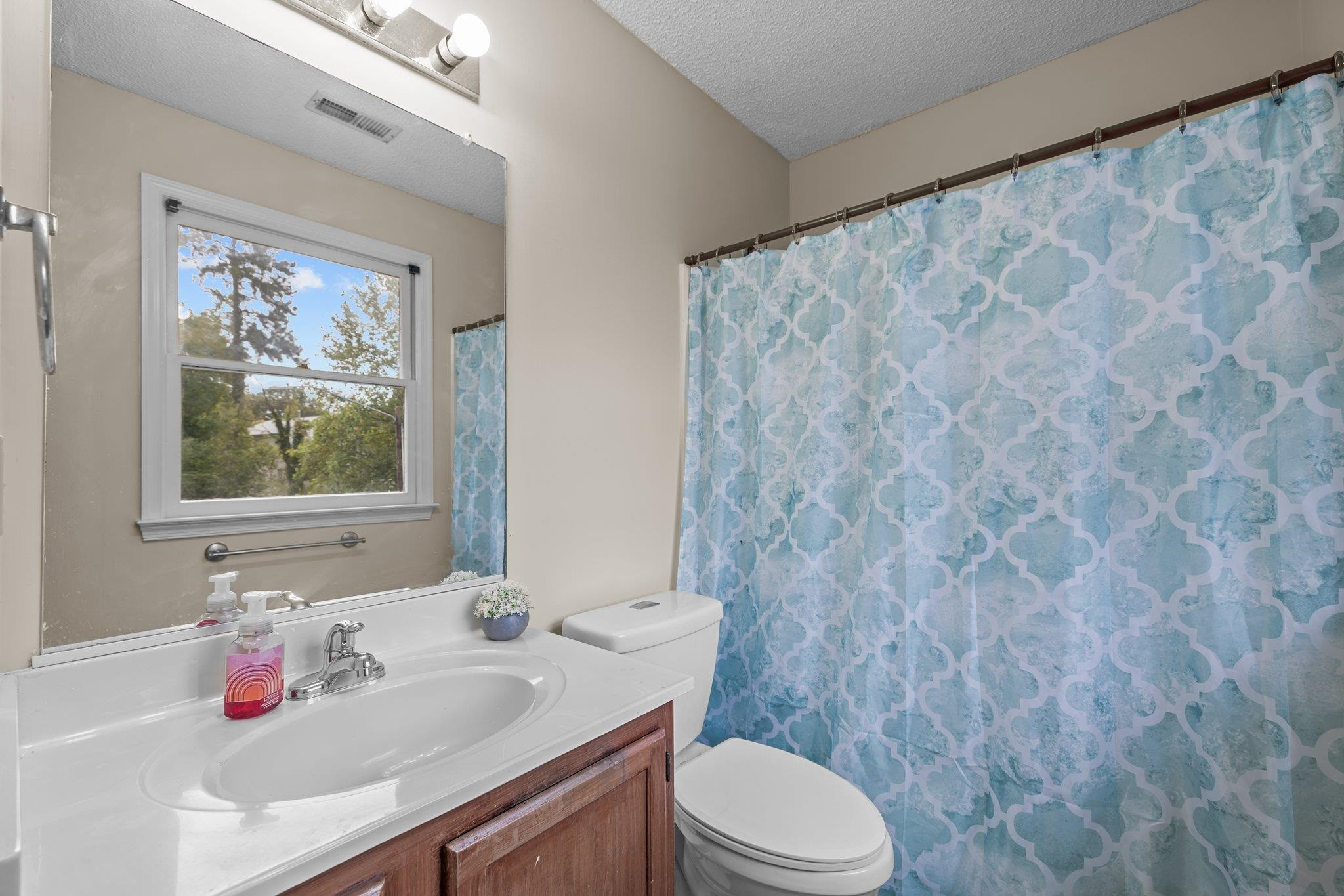 2208 Dobbin Place Raleigh, NC 27604 - Photo 25 of 42 a bathroom with a sink and a toilet