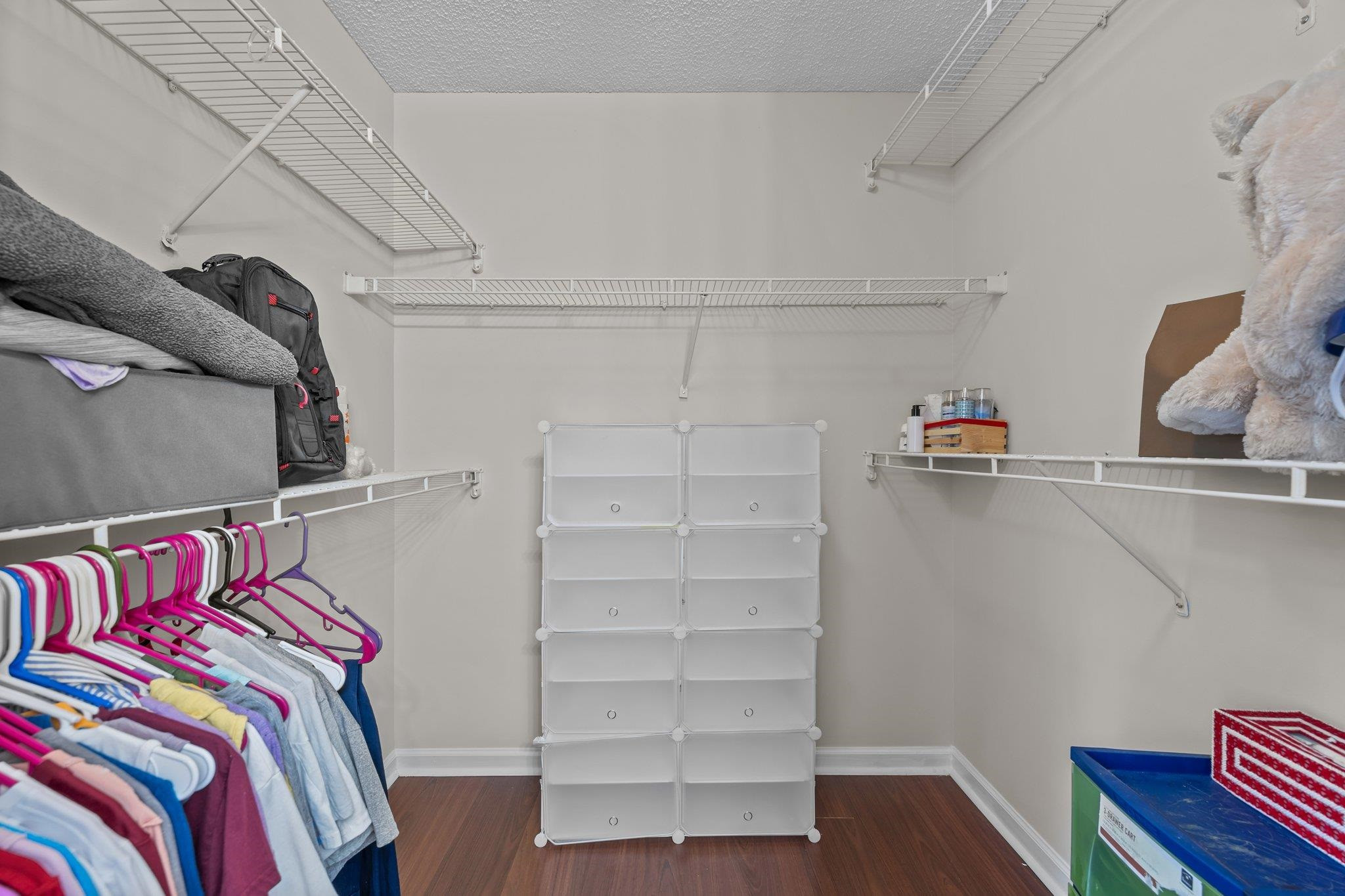 2208 Dobbin Place Raleigh, NC 27604 - Photo 26 of 42 a view of walk in closet with clothes and shoes