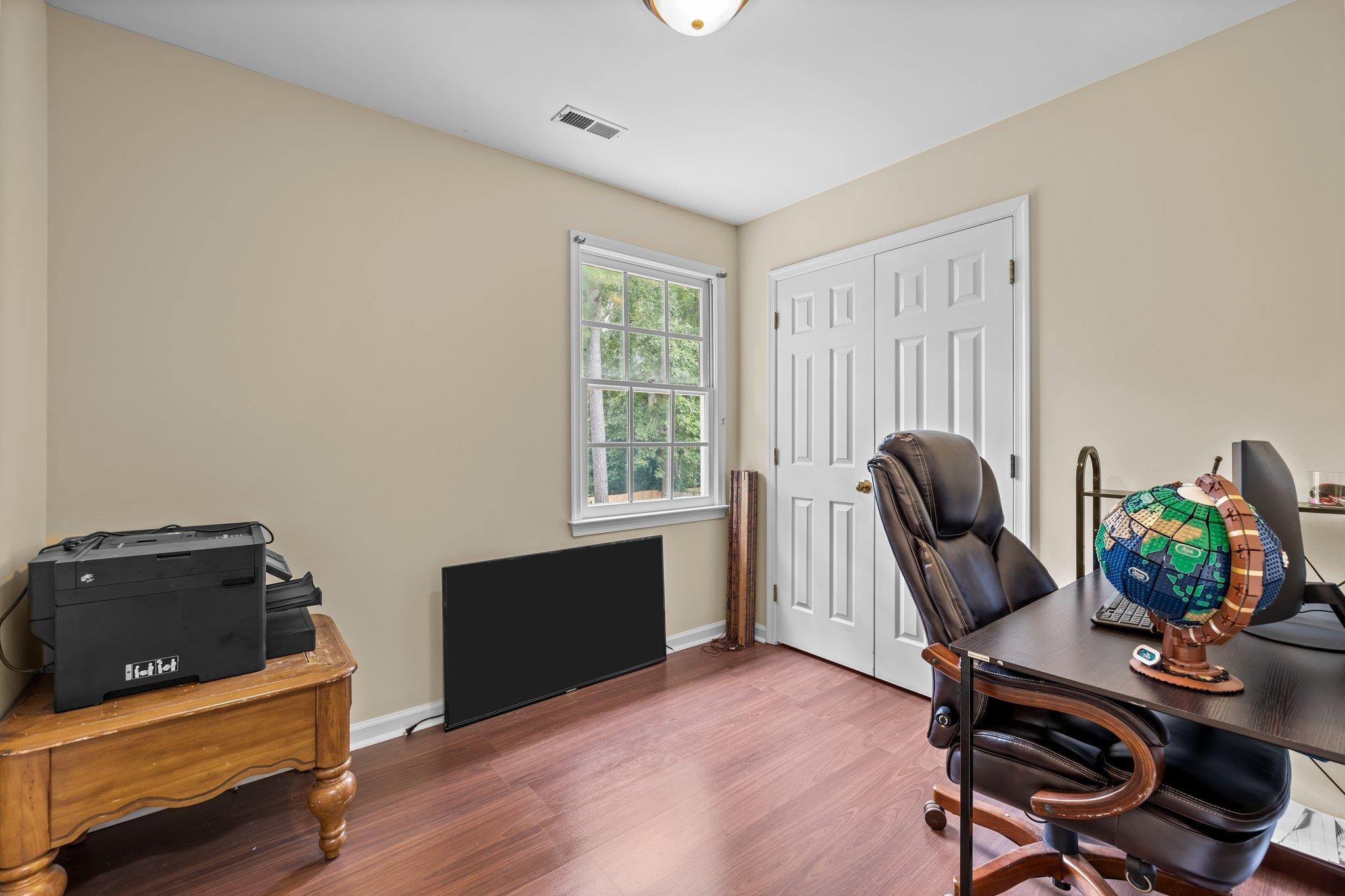 2208 Dobbin Place Raleigh, NC 27604 - Photo 27 of 42 a view of a workspace with furniture and a window