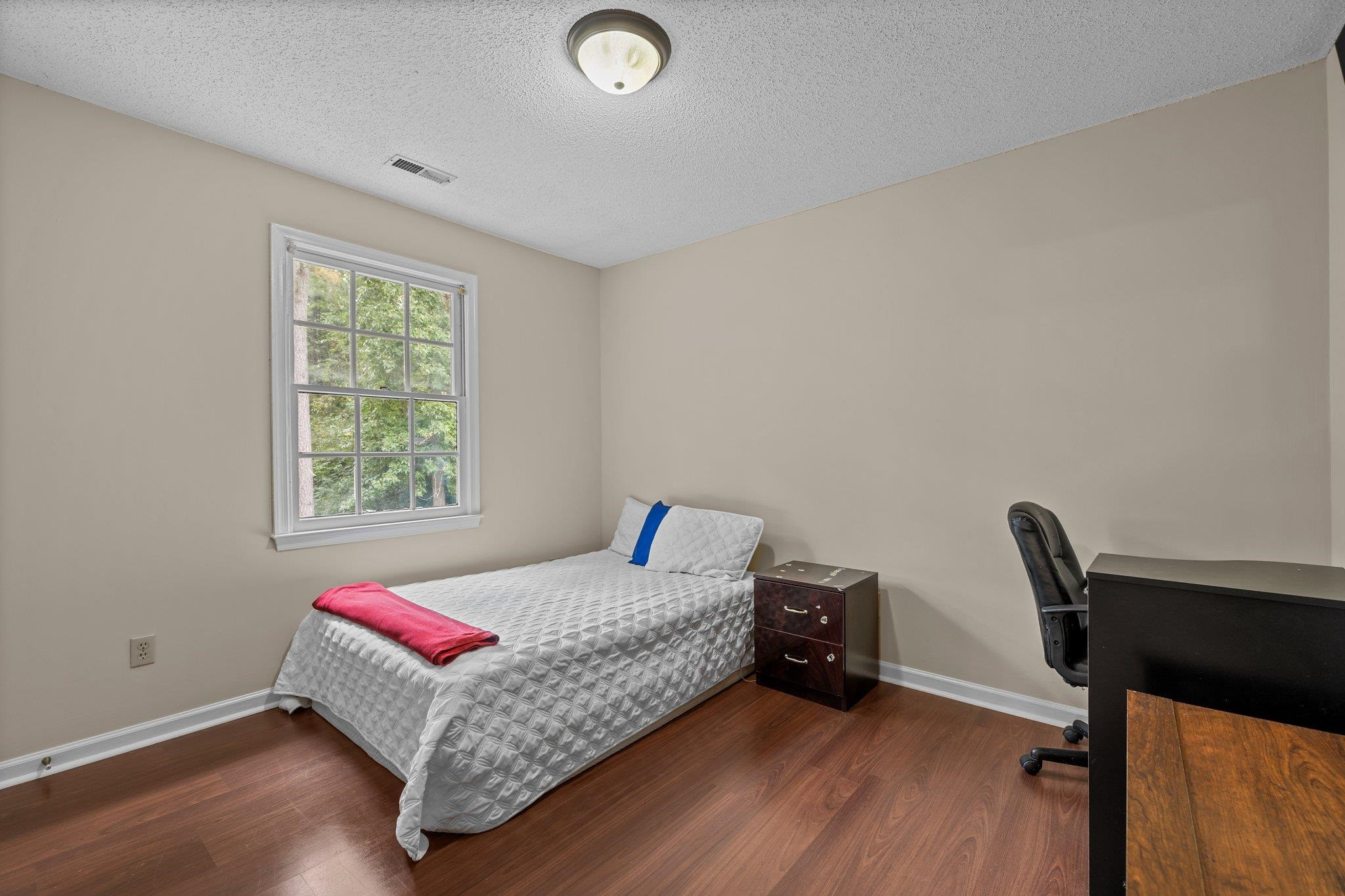 2208 Dobbin Place Raleigh, NC 27604 - Photo 29 of 42 a living room with furniture and a window