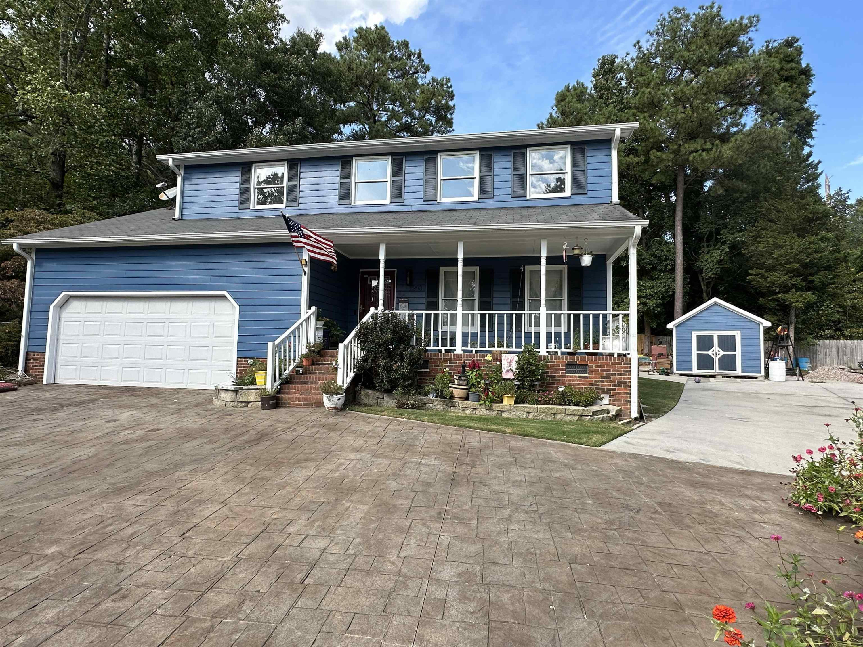 2208 Dobbin Place Raleigh, NC 27604 - Photo 3 of 42 a front view of a house with a yard and garage