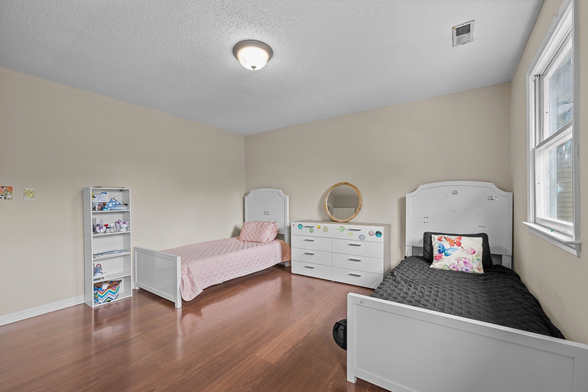 2208 Dobbin Place Raleigh, NC 27604 - Photo 31 of 42 a living room with furniture and a dresser next to a window