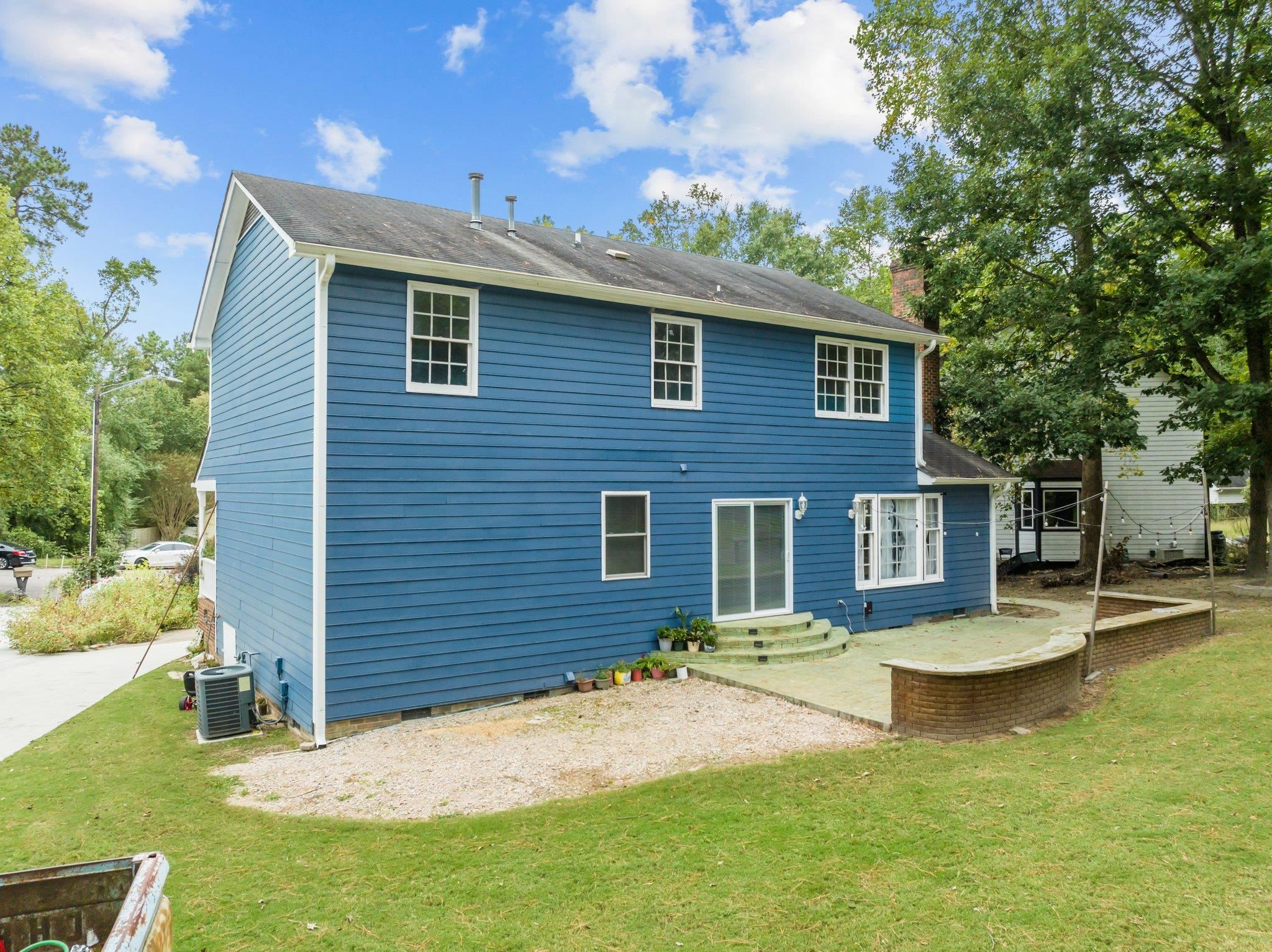 2208 Dobbin Place Raleigh, NC 27604 - Photo 32 of 42 a backyard of a house with yard table and chairs