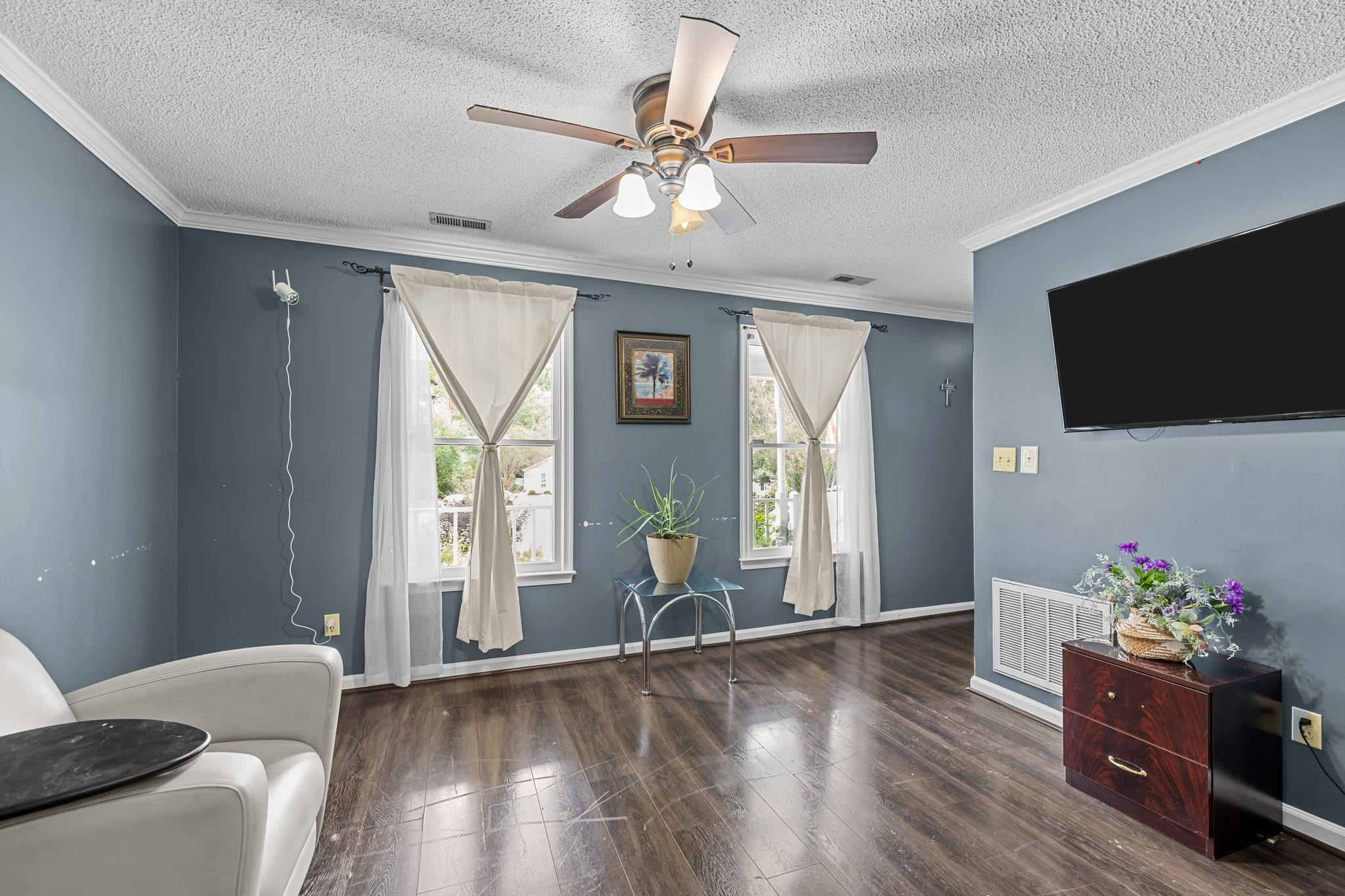 2208 Dobbin Place Raleigh, NC 27604 - Photo 8 of 42 a living room with furniture and a flat screen tv