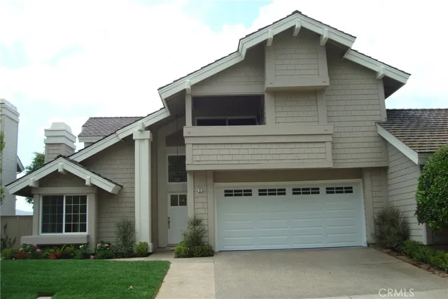 a front view of a house with a garage