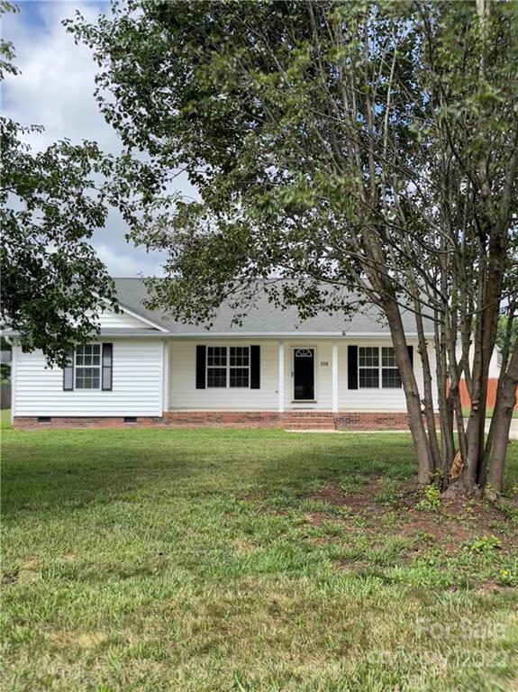 708 Patrick Road Gastonia, NC 28056 - Photo 1 of 15 a front view of a house with a garden