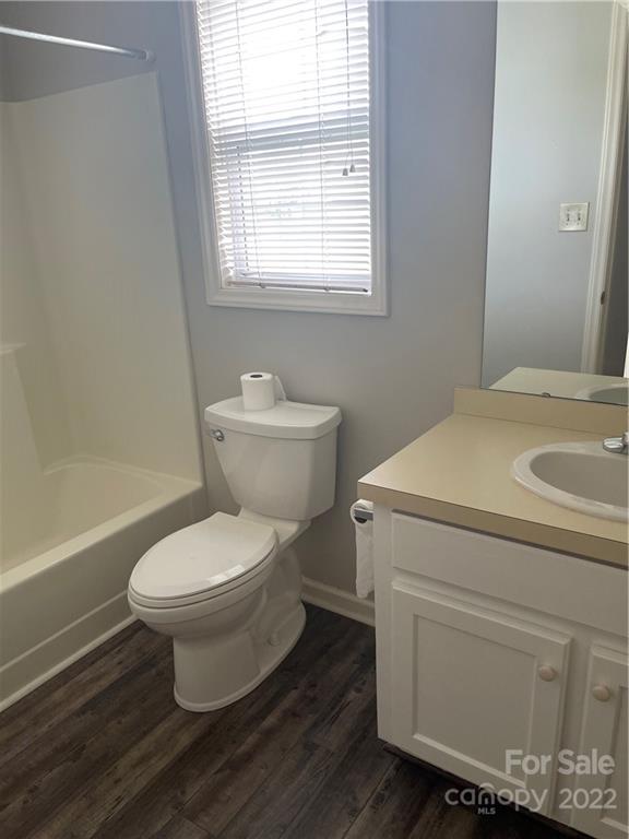 708 Patrick Road Gastonia, NC 28056 - Photo 13 of 15 a bathroom with a toilet sink and a bathtub