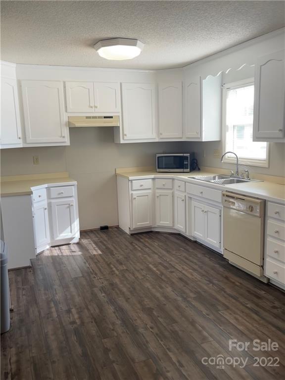 708 Patrick Road Gastonia, NC 28056 - Photo 6 of 15 a kitchen with stainless steel appliances granite countertop a sink a stove and cabinets