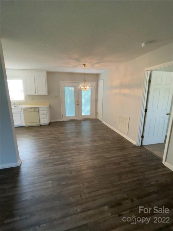 708 Patrick Road Gastonia, NC 28056 - Photo 9 of 15 a view of a kitchen with wooden floor and a sink