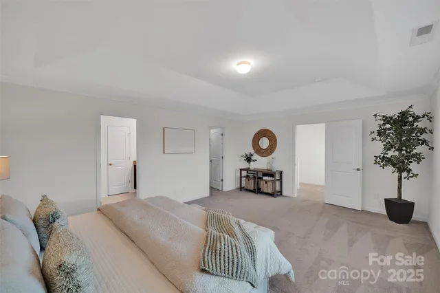 a white bath tub sitting next to a shower