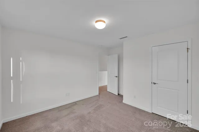 a view of a room with refrigerator and sink