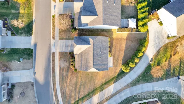 a view of a swimming pool with lounge chairs
