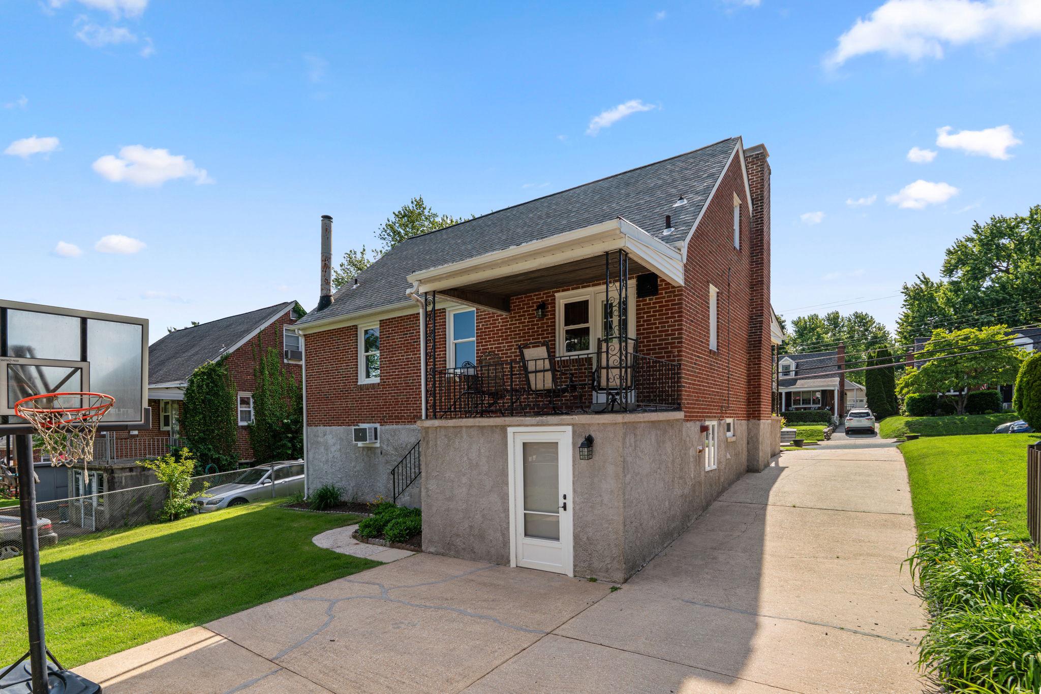305 Gralan Road Catonsville, MD 21228 - Photo 33 of 38 Lower level walkout to parking, lush yard, garage