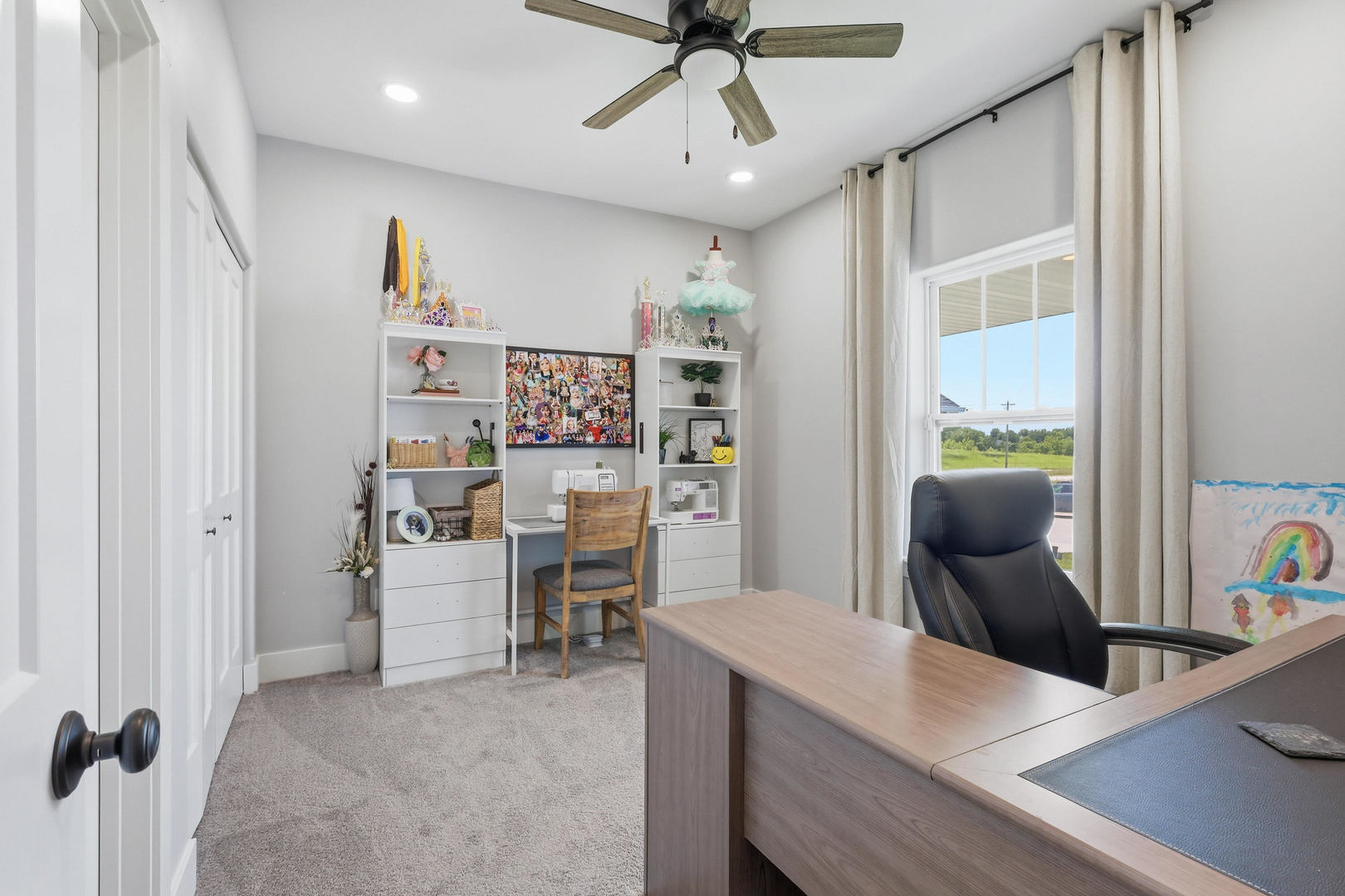 6779 Genesis Way Bettendorf, IA 52722 - Photo 5 of 36 a view of a workspace with furniture and a window