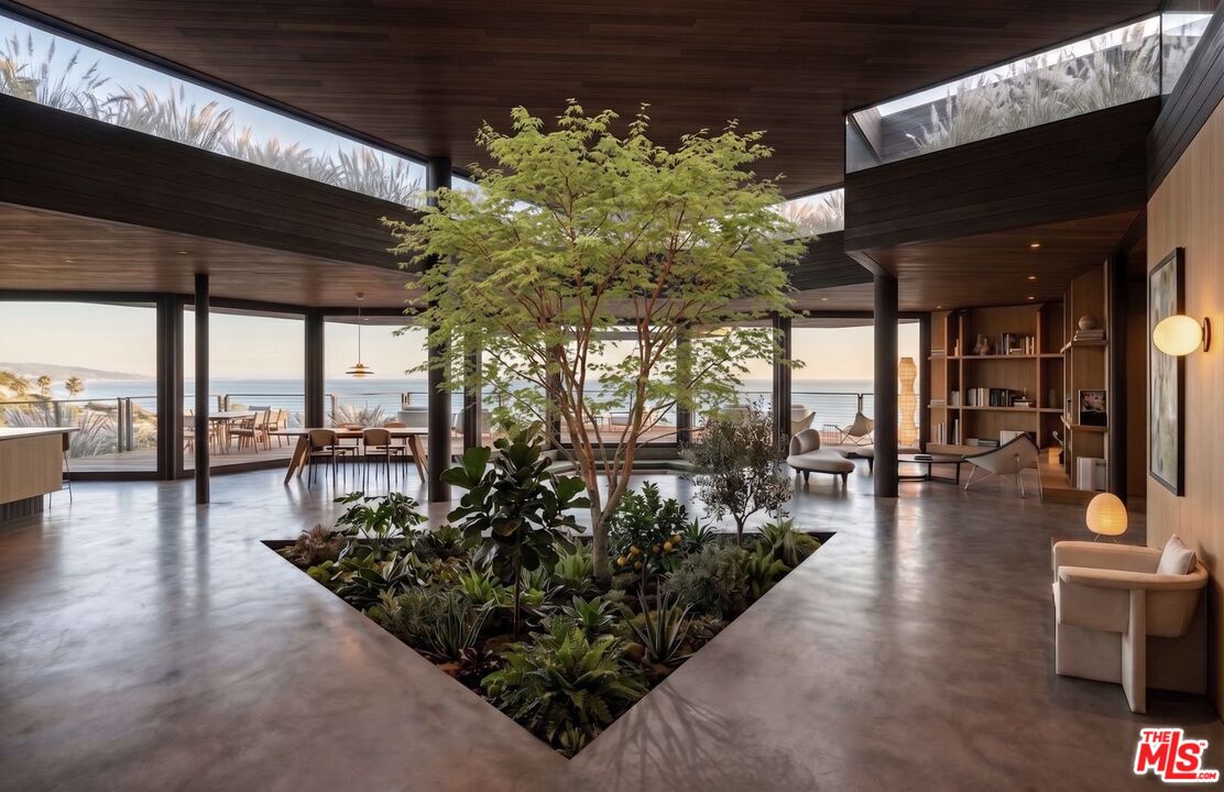 30000 Zenith Point Road Malibu, CA 90265 - Photo 13 of 15 an outdoor space with seating area and trees in the background