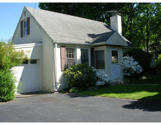 a front view of house with garden