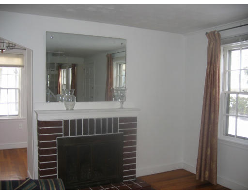 99 Russell Road Newton, MA 02465 - Photo 4 of 12 a bathroom with a sink a mirror and a window