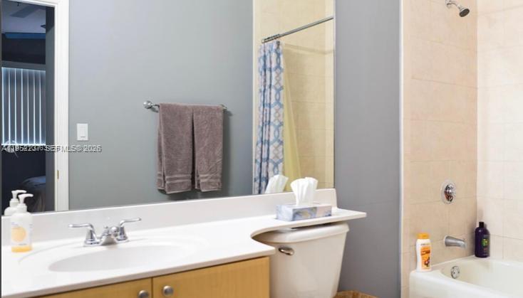 2280 Southwest 32nd Avenue, Unit 613 Miami, FL 33145 - Photo 13 of 15 a bathroom with a sink and a mirror