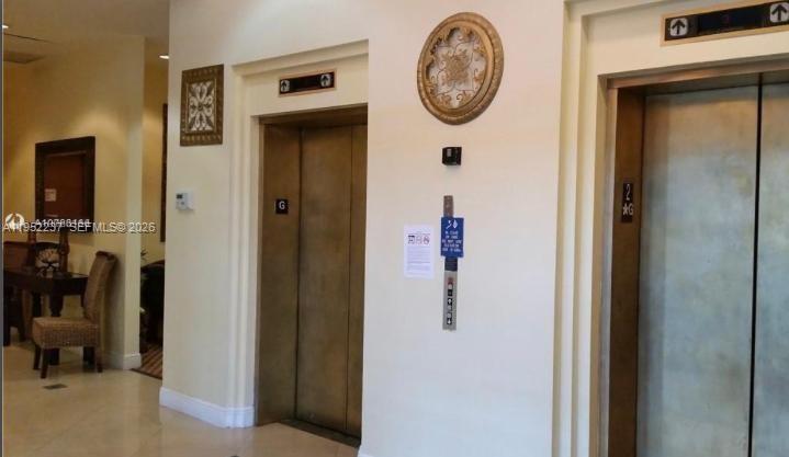 2280 Southwest 32nd Avenue, Unit 613 Miami, FL 33145 - Photo 14 of 15 a view of a hallway with elevator