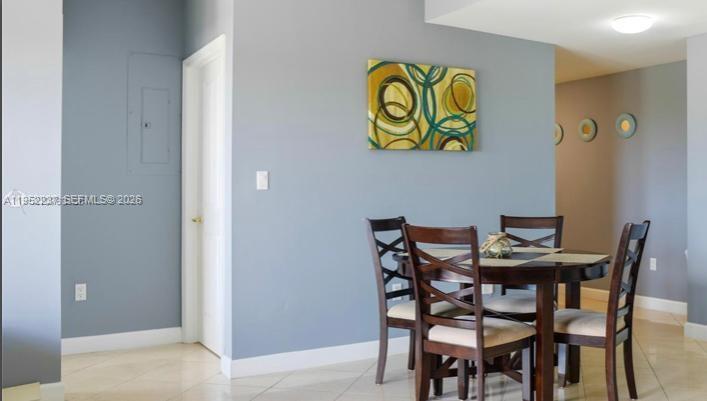 2280 Southwest 32nd Avenue, Unit 613 Miami, FL 33145 - Photo 15 of 15 a view of a dining room with furniture and a potted plant