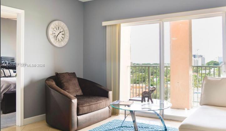 2280 Southwest 32nd Avenue, Unit 613 Miami, FL 33145 - Photo 3 of 15 a living room with furniture and a window