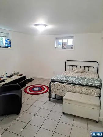 a bedroom with a bed and a mirror