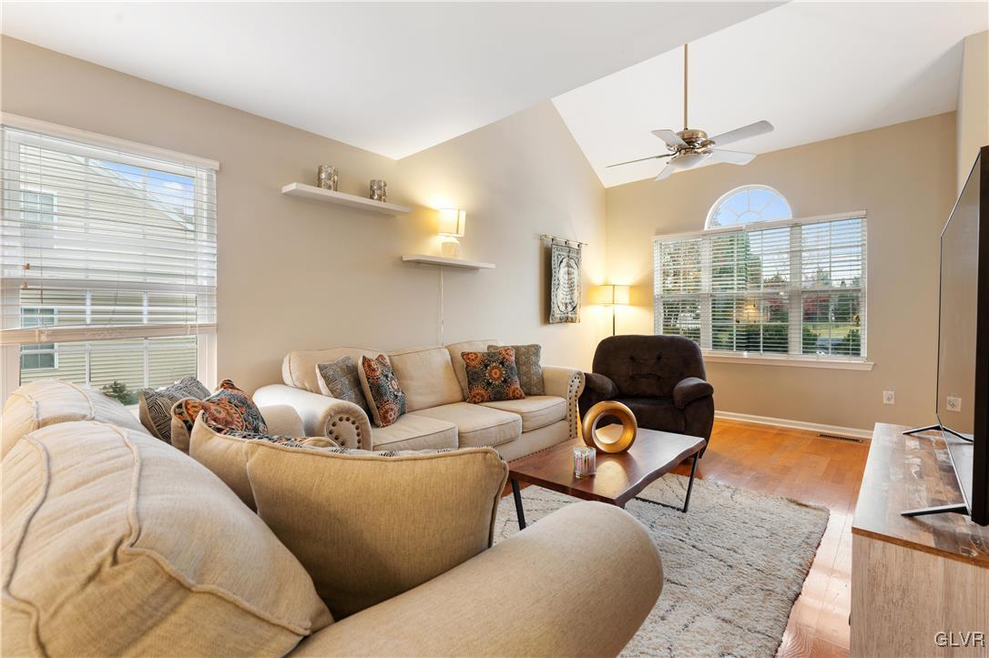 2229 Juniper Drive Coplay, PA 18037 - Photo 17 of 52 a living room with furniture a chandelier and a window